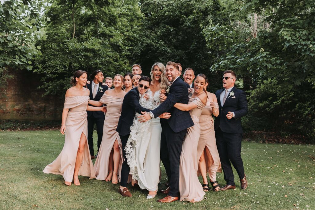 bridal party hugging at careys manor wedding
