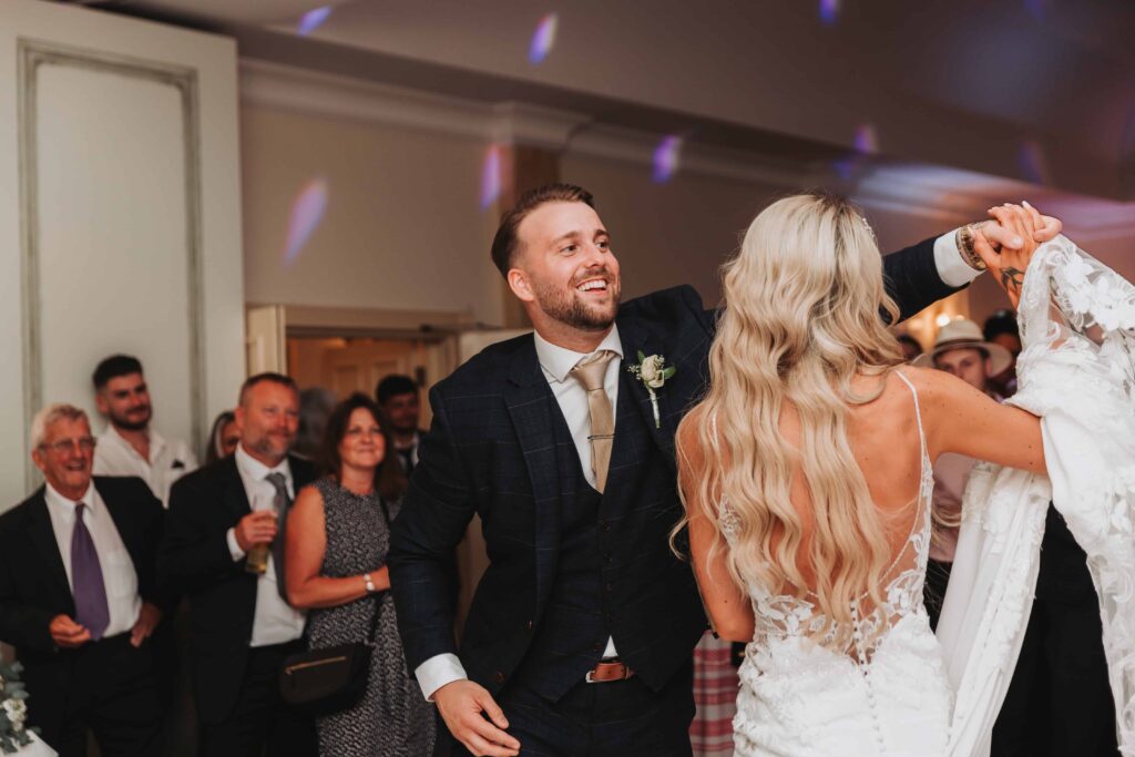 groom smiling in first dance