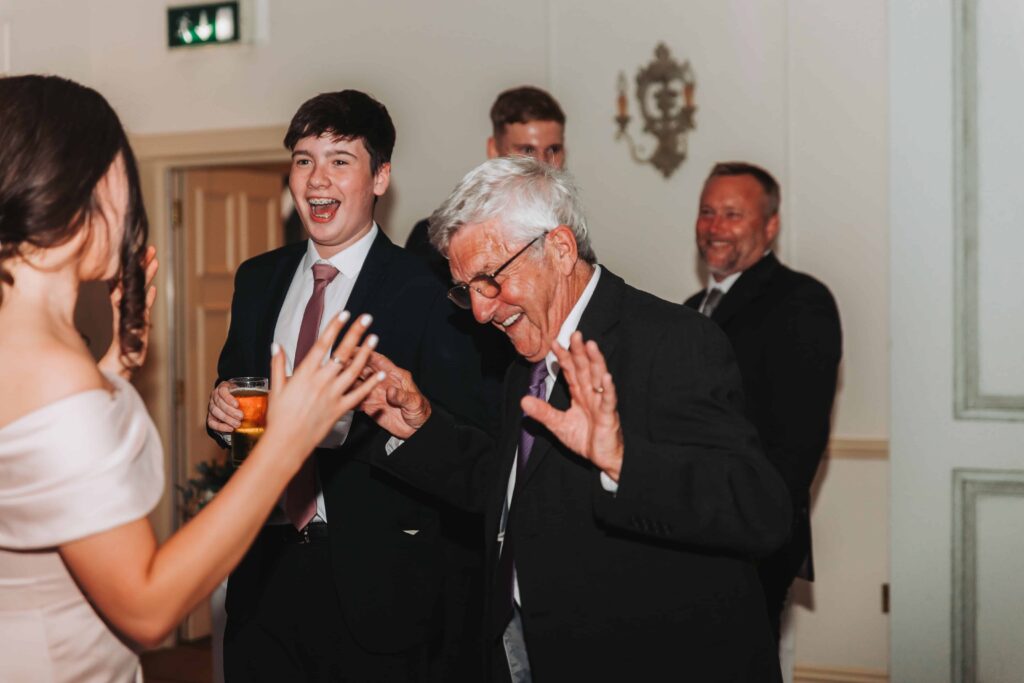 older man dancing at a wedding