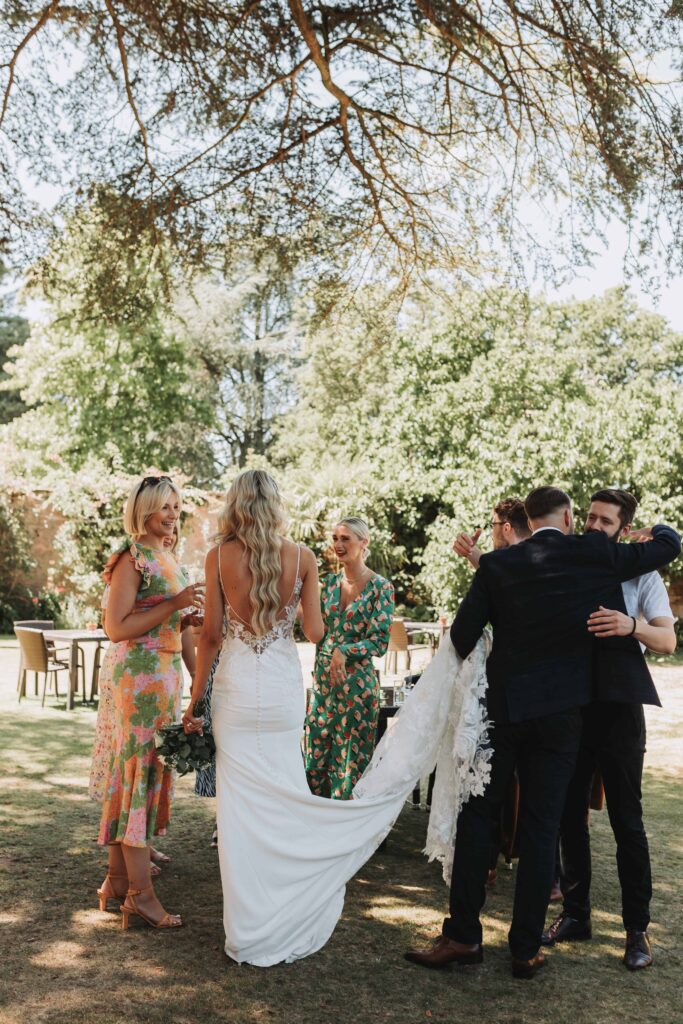 bride and groom greeting guests at careys manor wedding