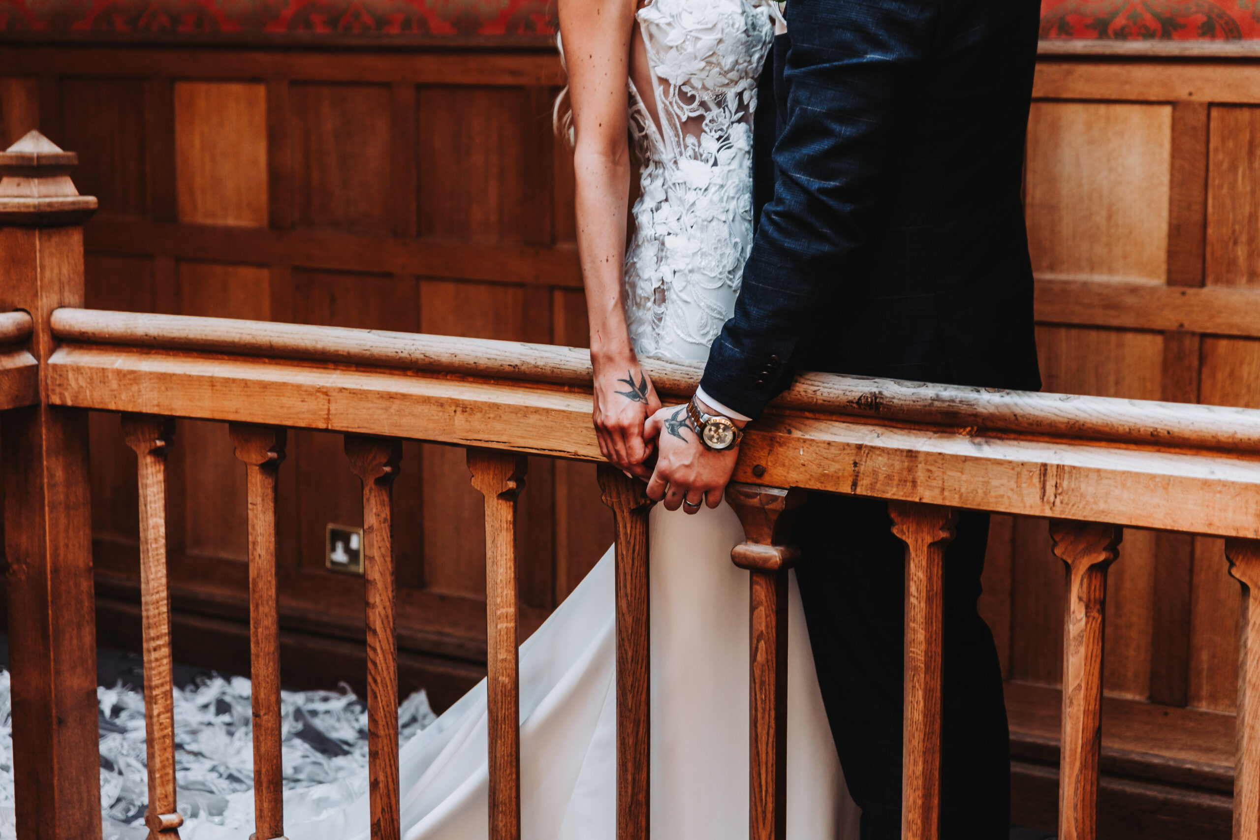 couples hands on a bannister