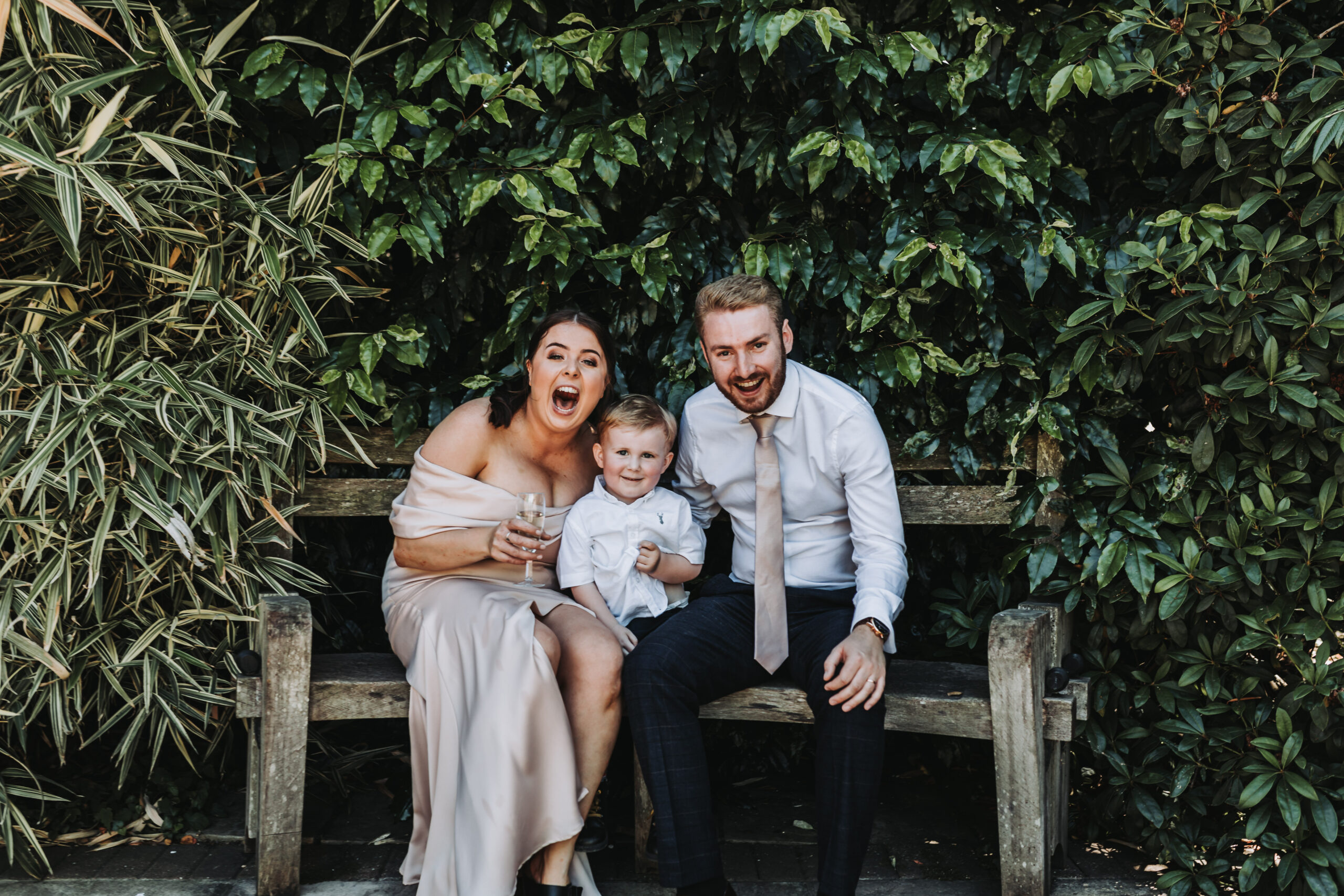 couple and child at careys manor wedding