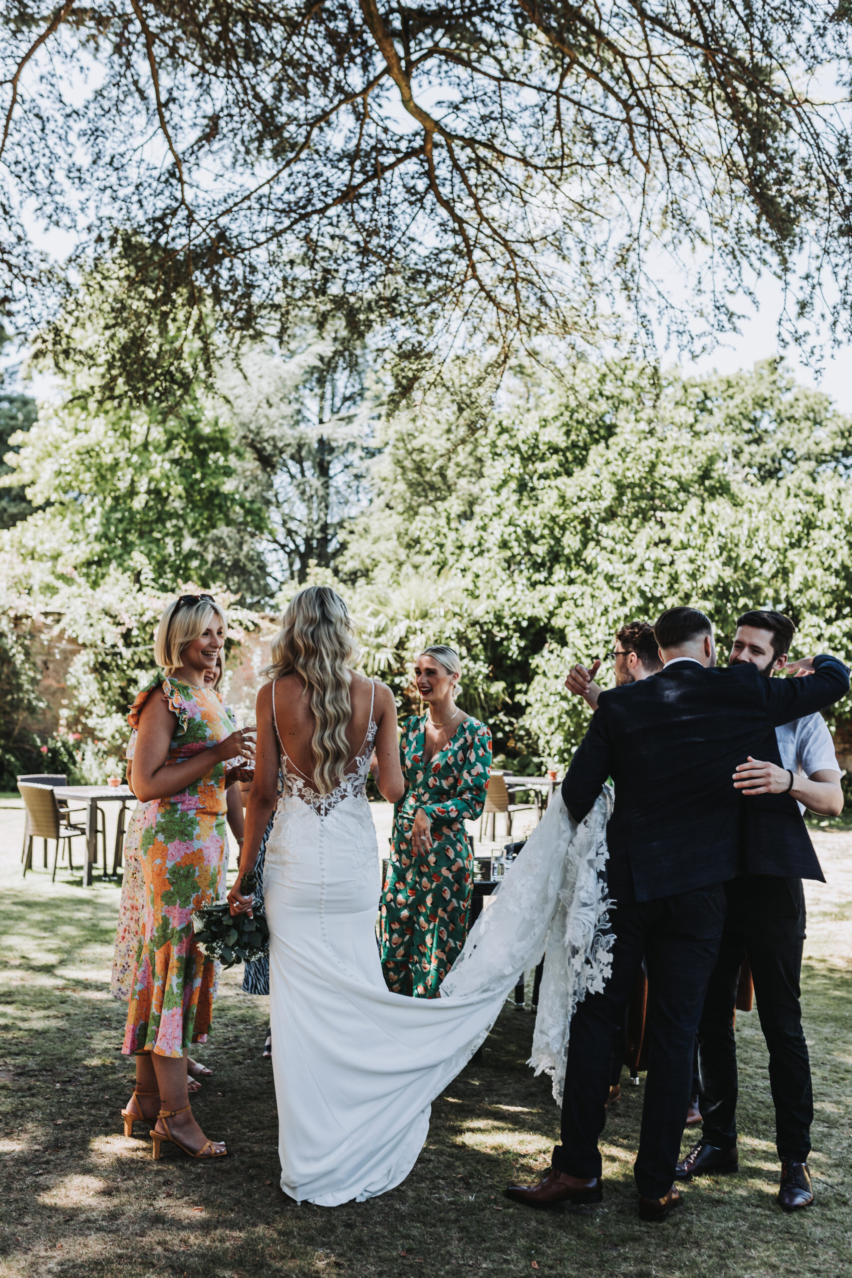 bride and groom greeting guests at careys manor wedding
