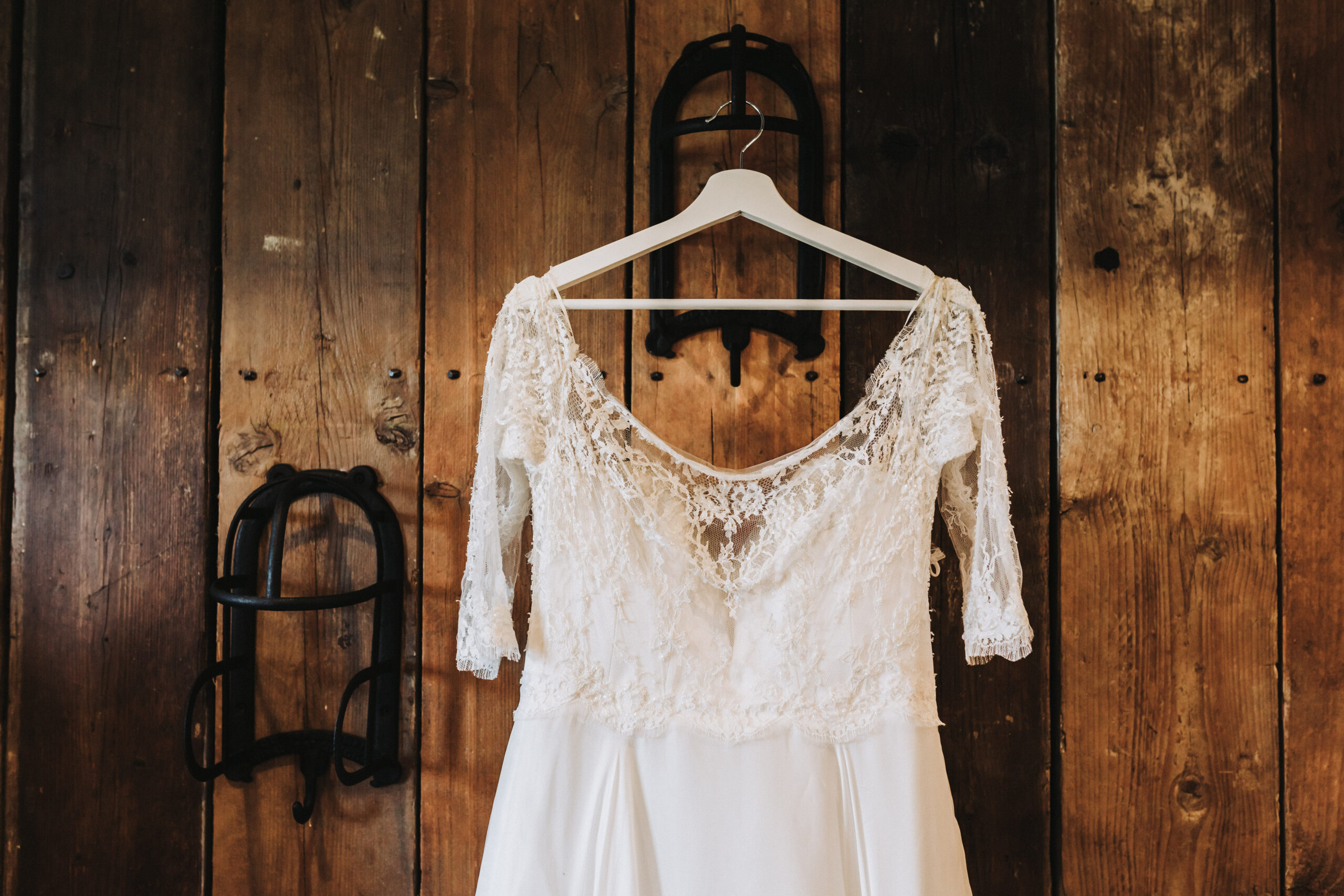 wedding dress hung up at clock barn