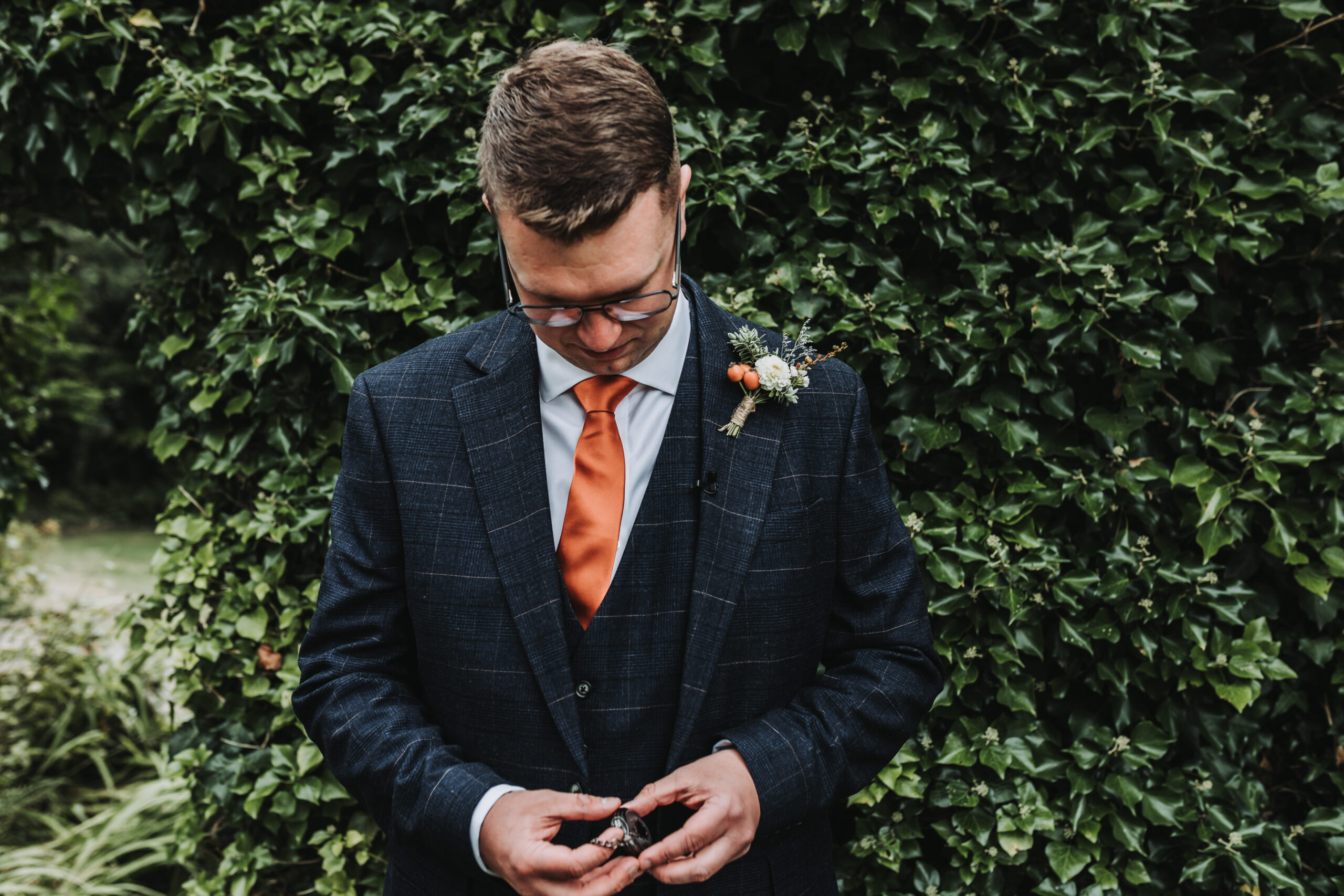 groom looking at pocket watch