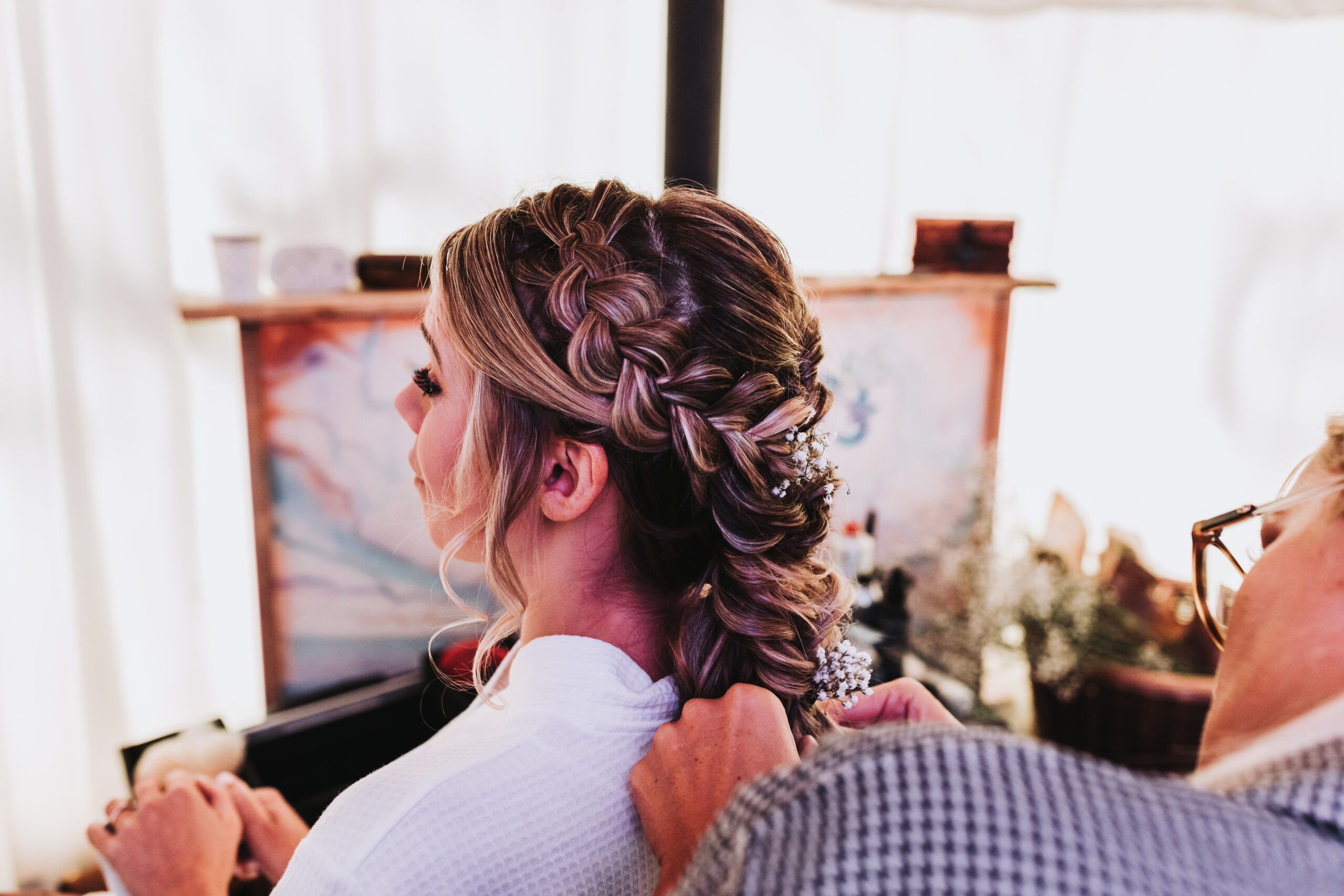 bride having her hair done in a yurt