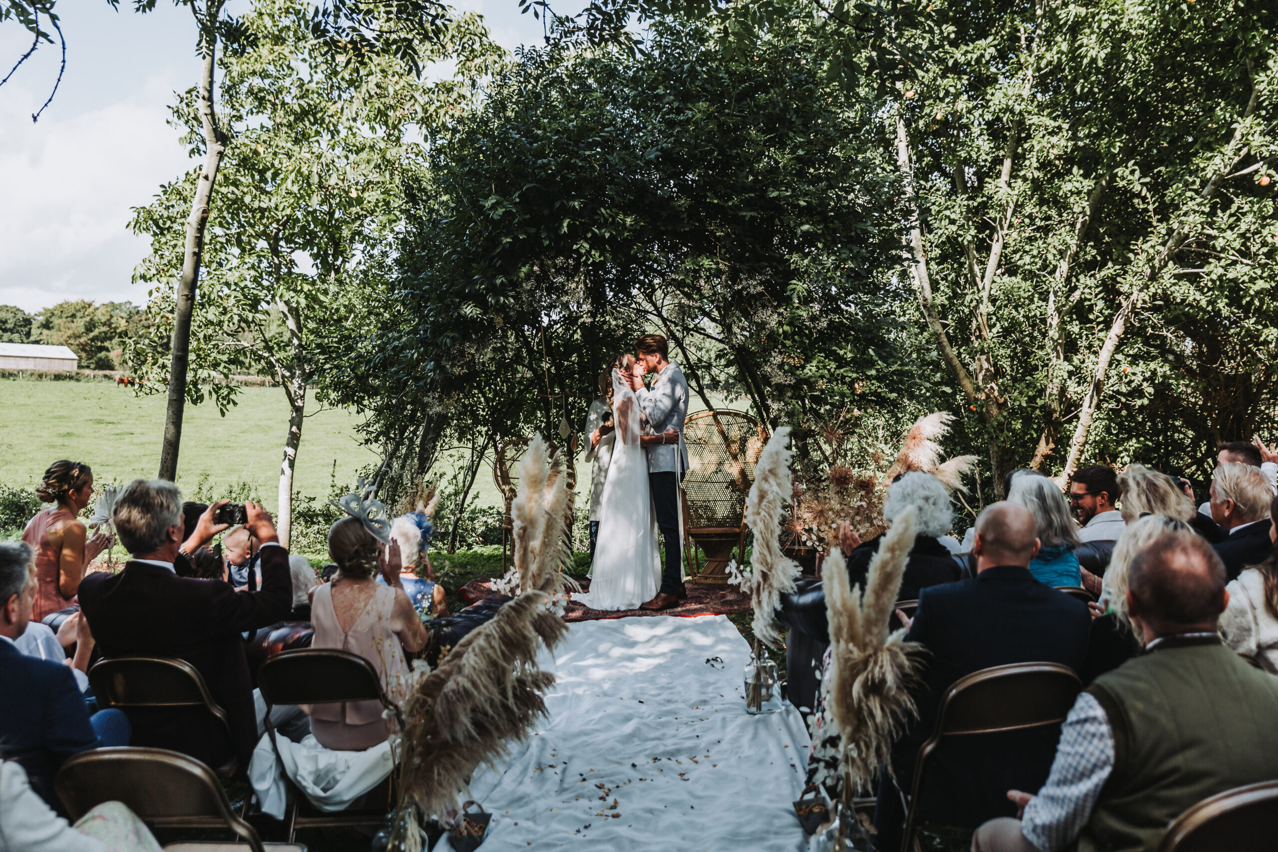 first kiss at woodland wedding