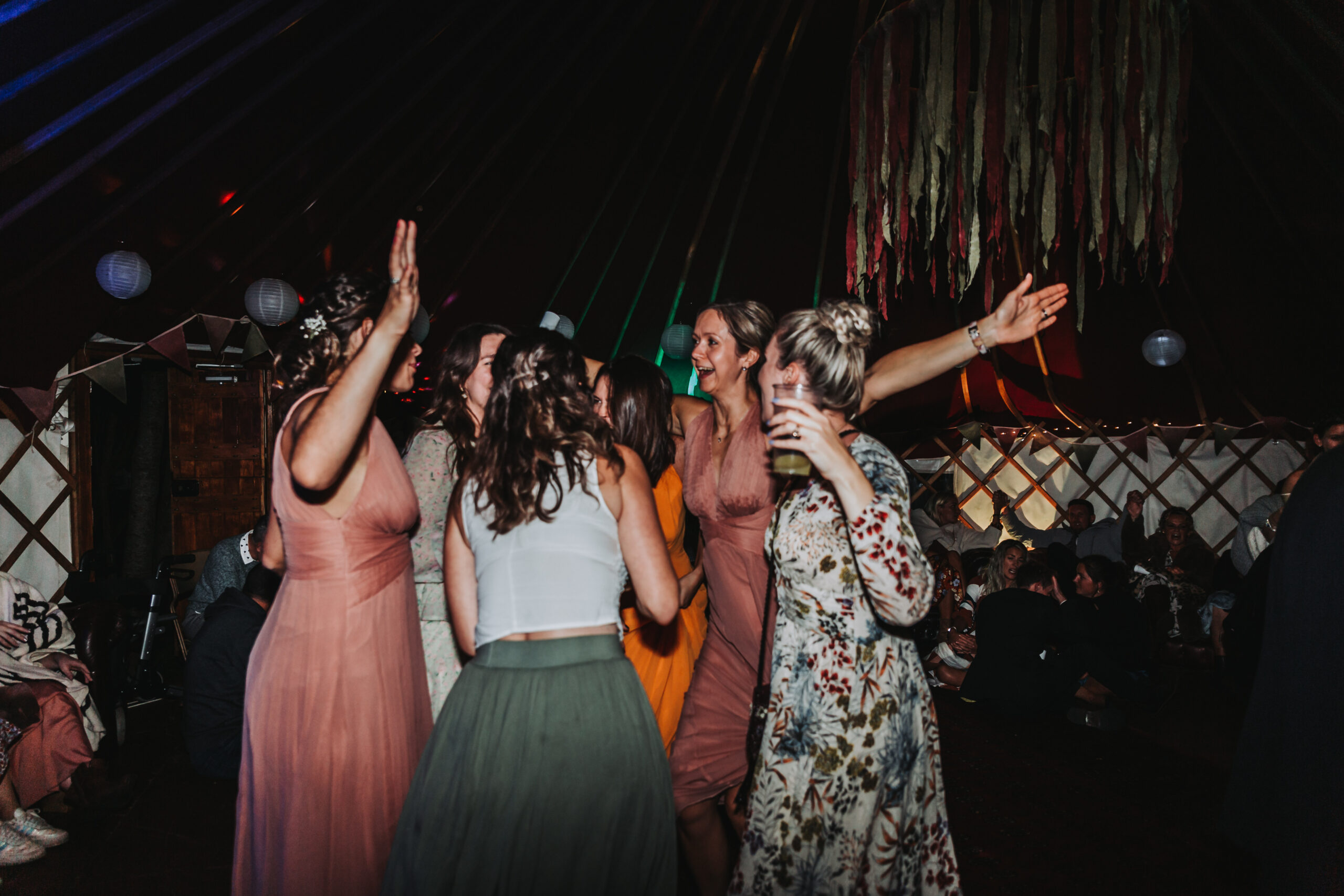 wedding guests dancing in a yurt