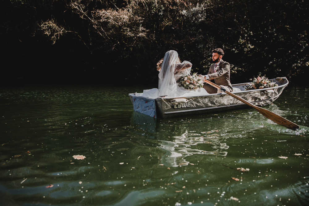just married couple in rowing boat