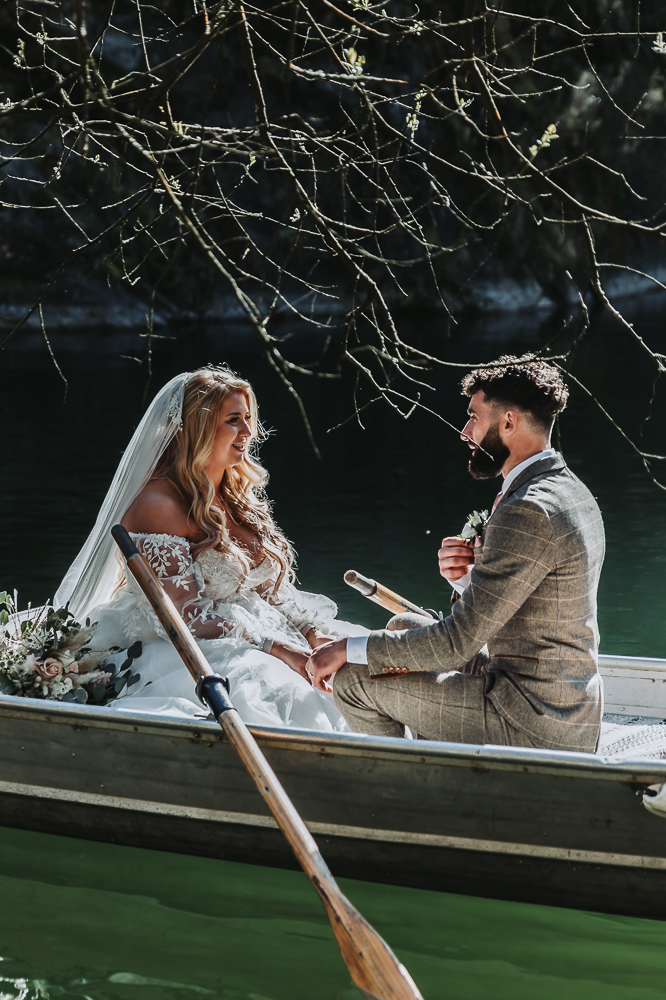 couple in boat at cornish tipi wedding