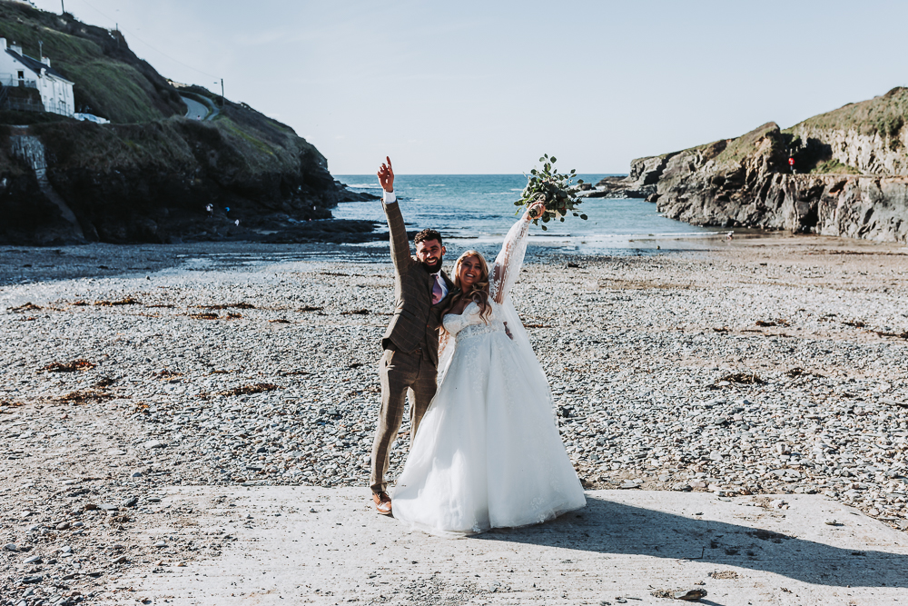just married couple on cornish beach