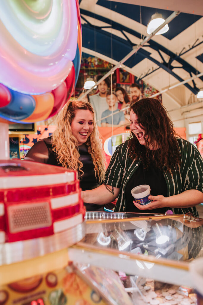 lgbtq+ couple in arcade