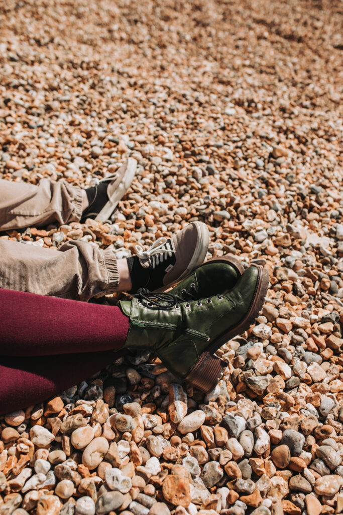 shoes on beach taken by lgbtq+ photographer