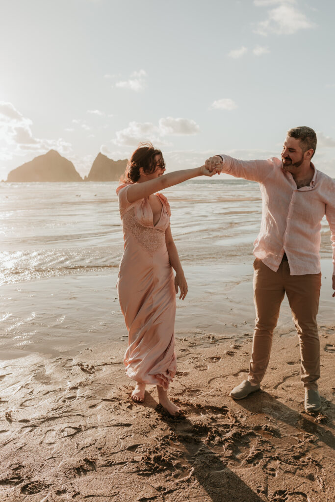 dancing at beach anniversary photo session