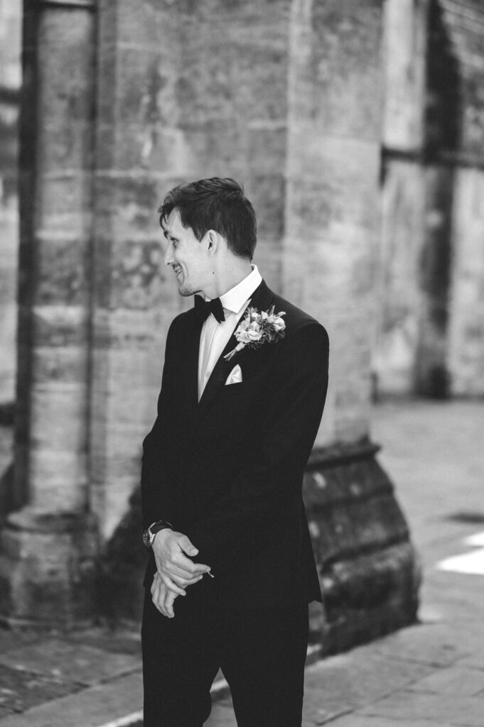 groom outside romsey abbey