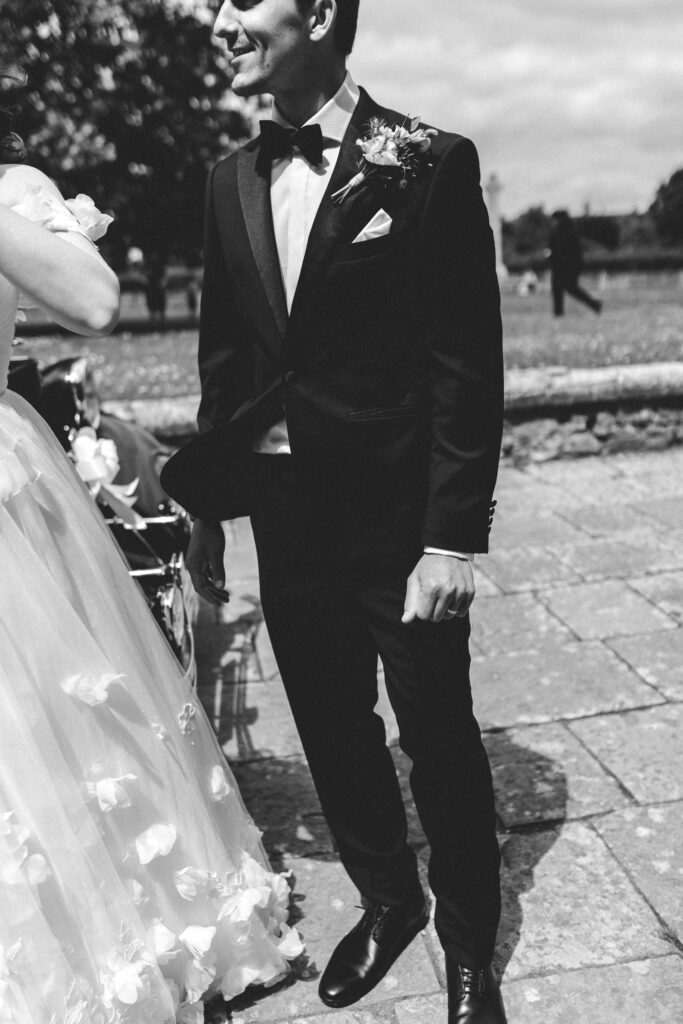 groom in tux outside romsey abbey