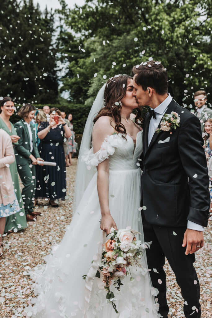 married kiss by hampshire wedding photographer