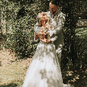 groom stood behind bride hugging her at chycara wedding