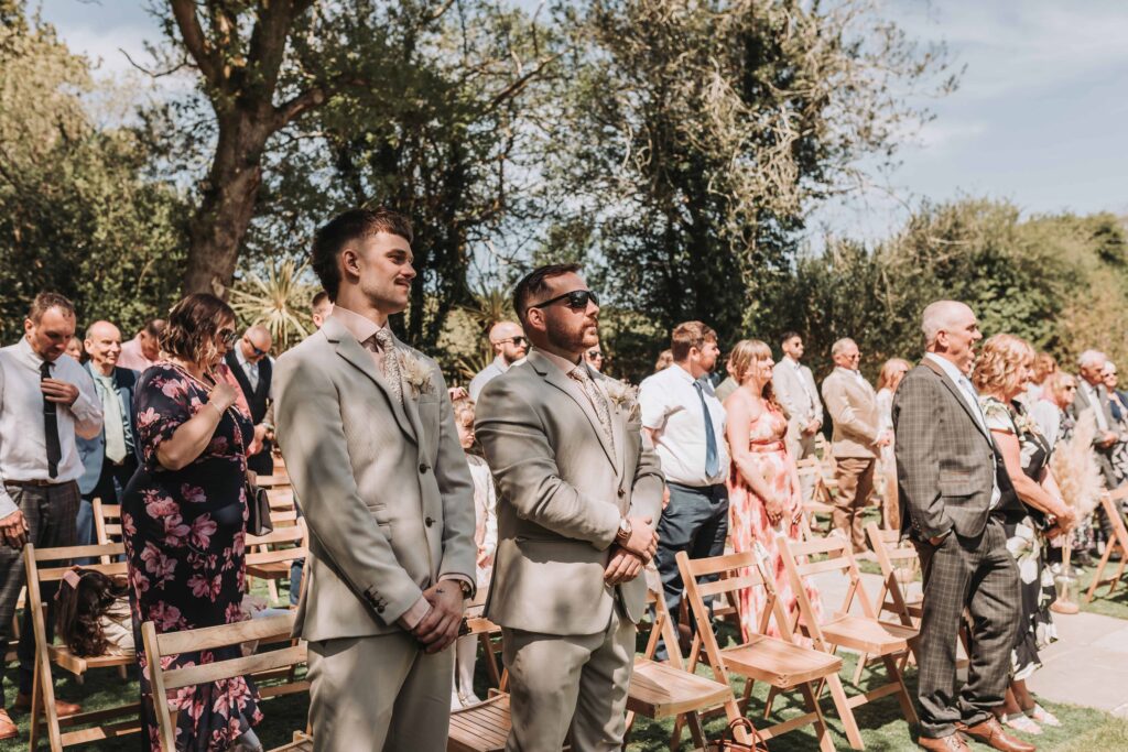 guests watching and smiling at chycara wedding