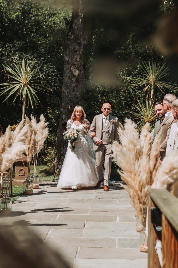 dad walking daughter down the aisle at chycara wedding