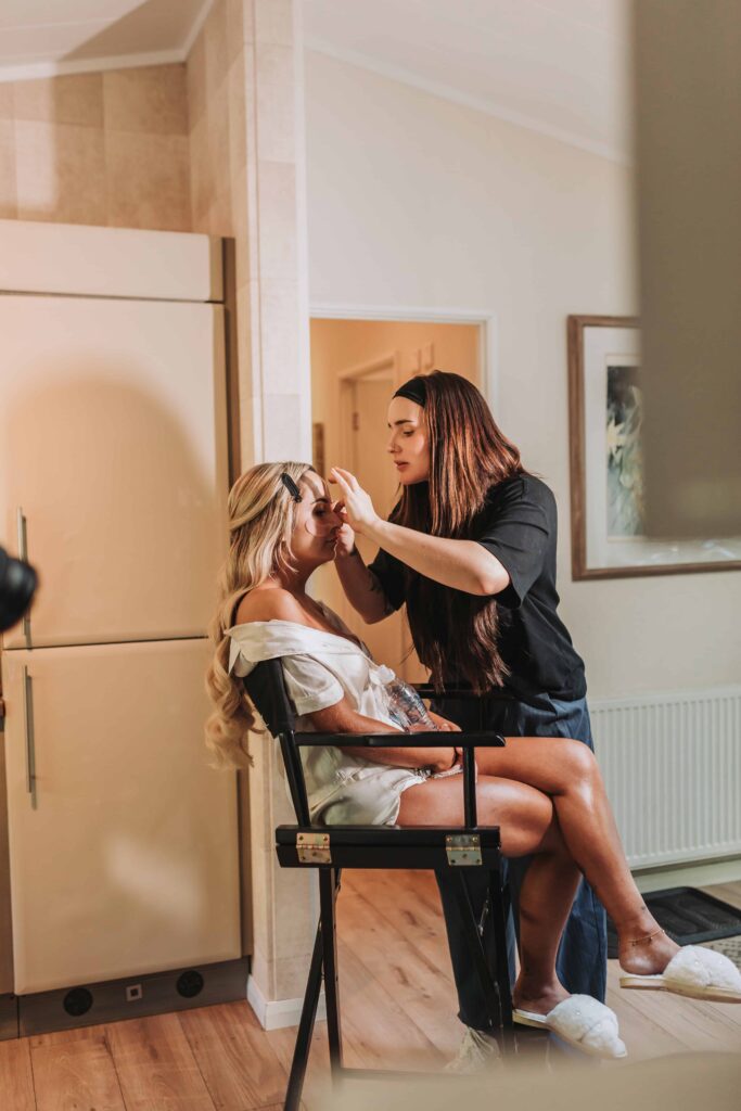 bride having her make up done at chycara wedding