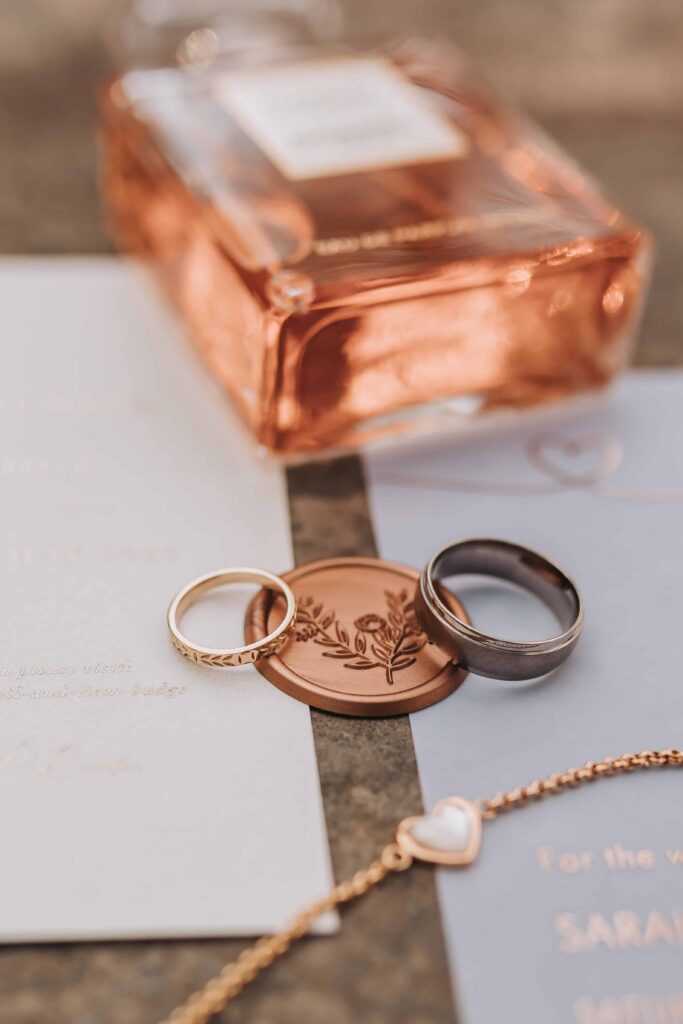 rings in bridal flat lay at chycara wedding