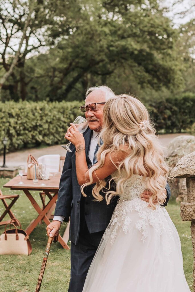 bride giving grandad a drink