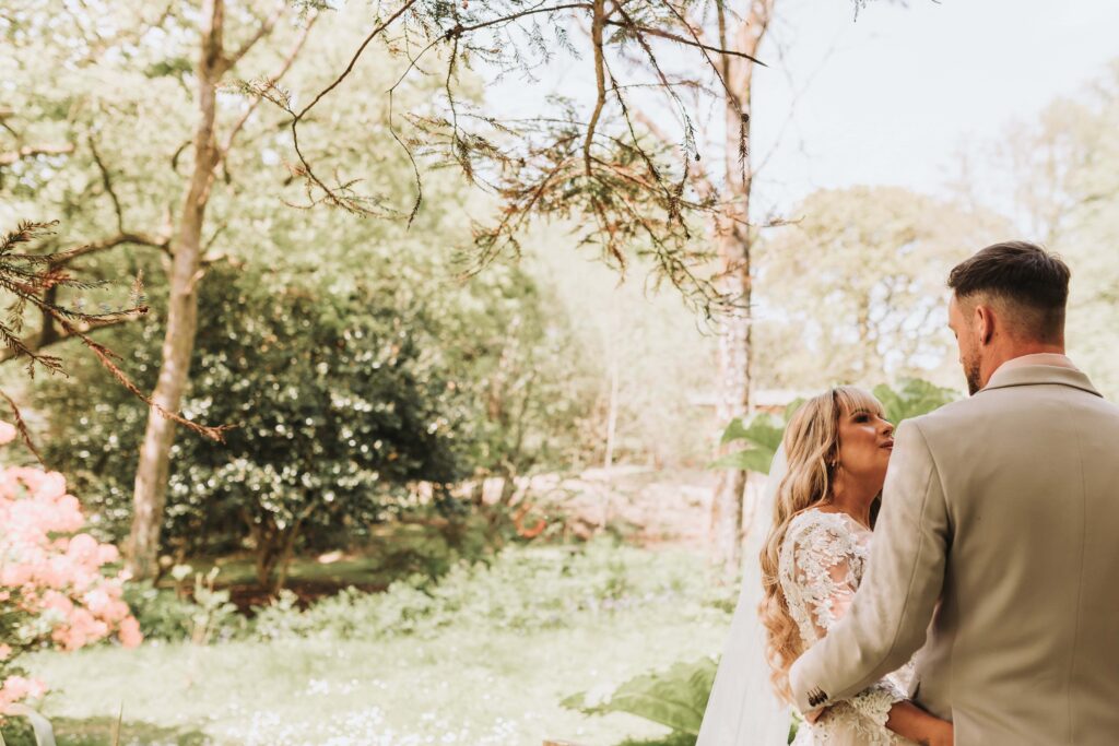 bride and groom holding eachother at chycara wedding