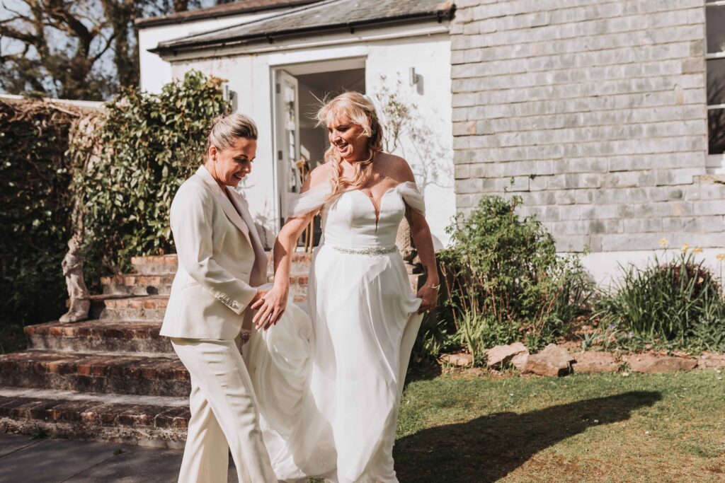 two brides walking at treseren photo by lgbtq+ wedding photographer