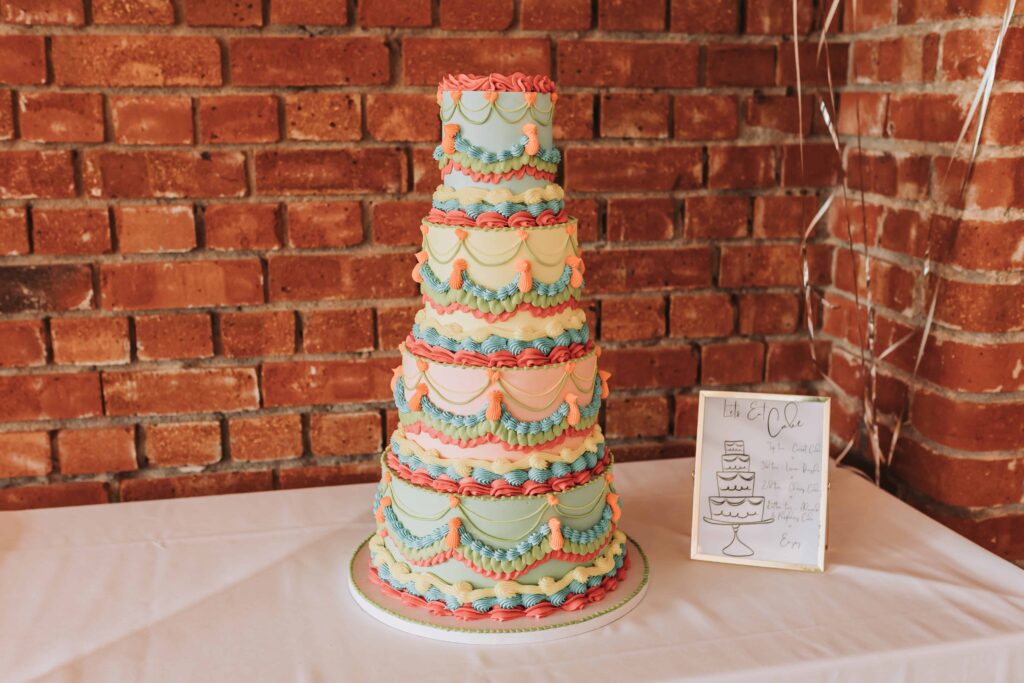 brightly coloured wedding cake at the green cornwall