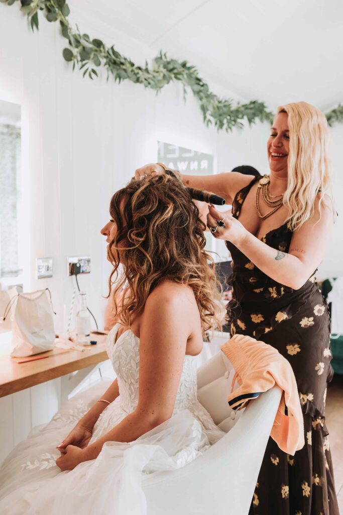 bride having her hair done at the green cornwall