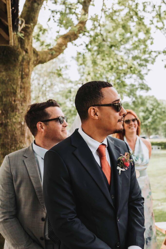 grooms reaction at the end of the aisle