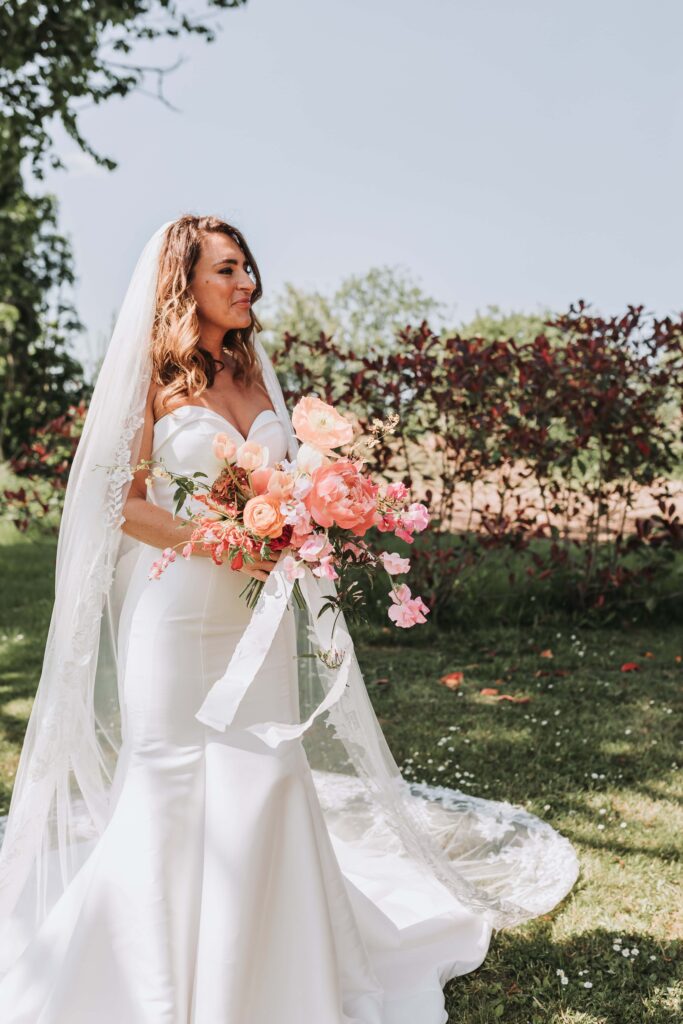 bride holding bouquet at the green cornwall