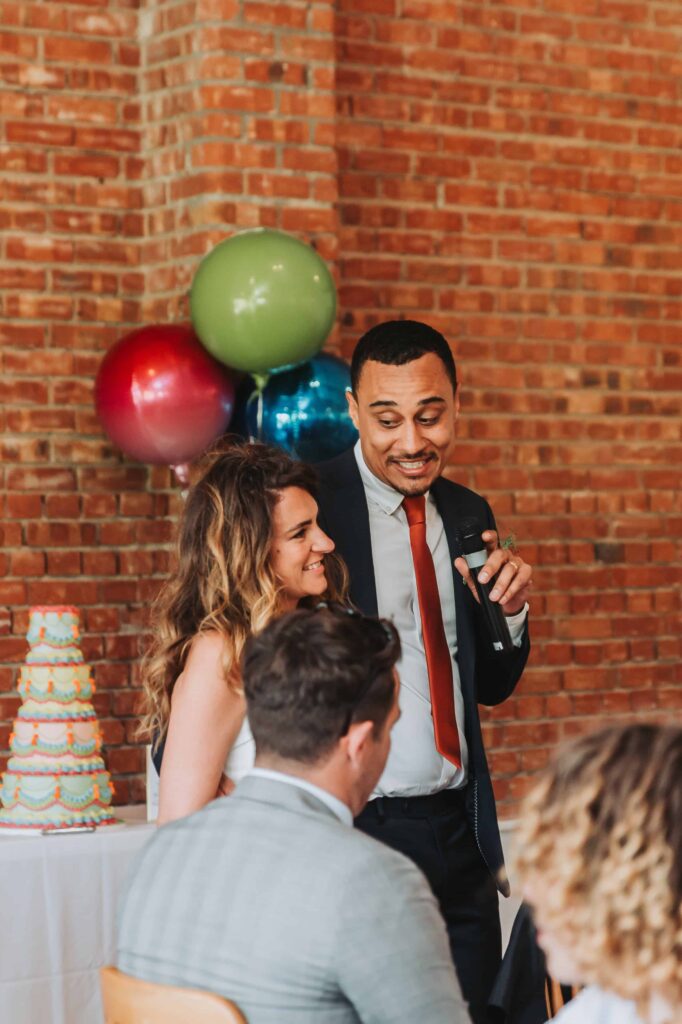 bride and groom doing a speech at the green cornwall