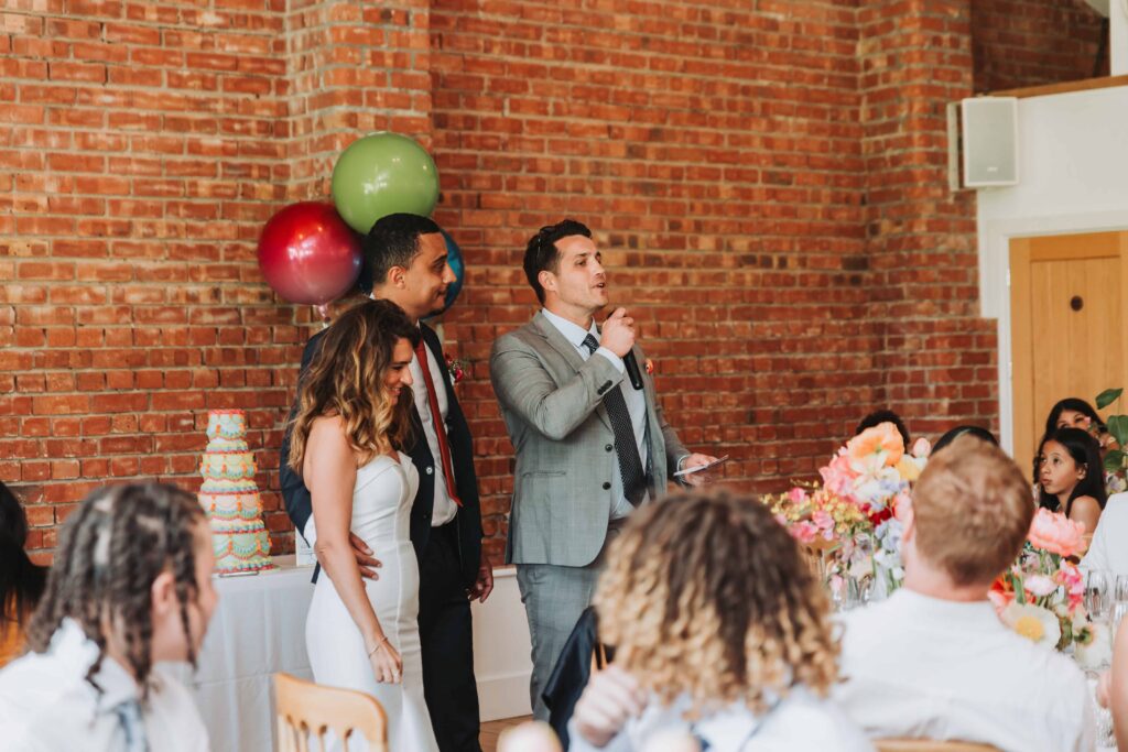 best man bride and groom giving speeches