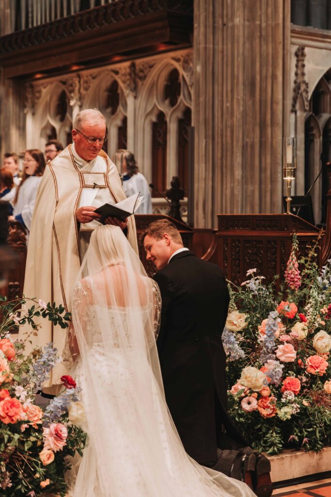 bride and groom kneeling at bristol wedding