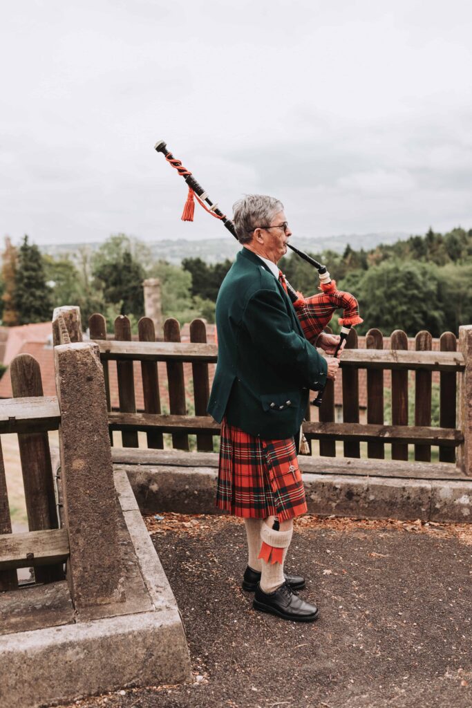 scottish man playing bagpipes at bristol wedding
