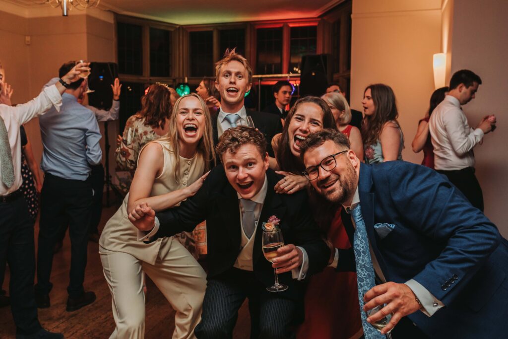 guets smiling for a photo at bristol wedding