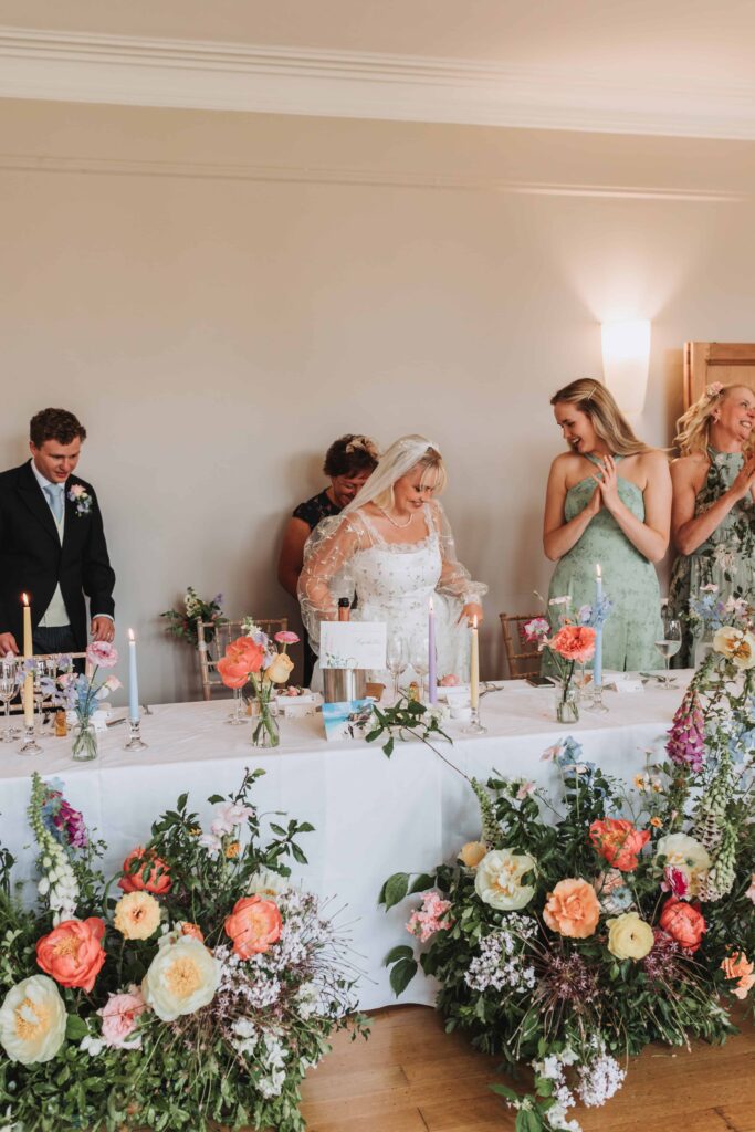 bride being seated at coombe lodge wedding