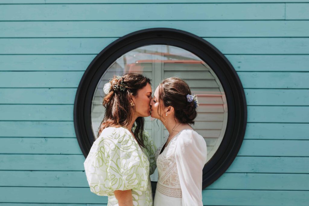 two brides kissing at lgbtq wedding