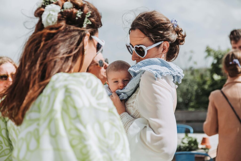 bride holding baby