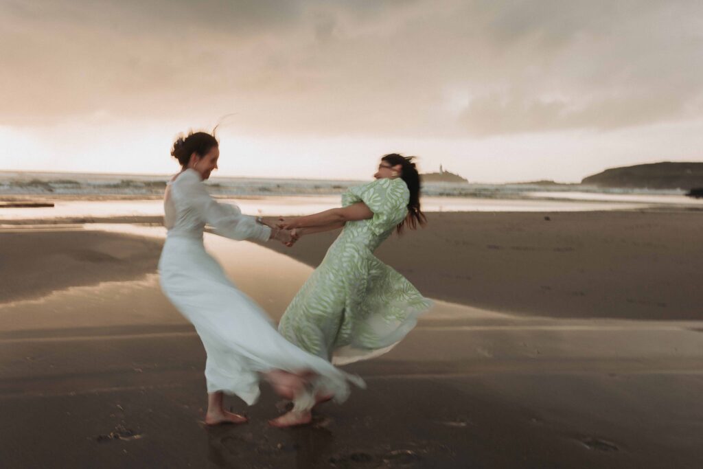 brides spinning on cornish beach
