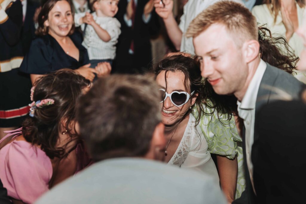 brides on dancefloor by lgbtq wedding photographer