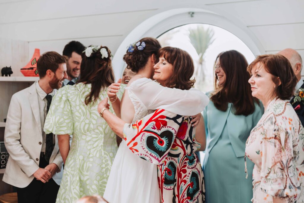 bride greeting mum by lgbtq wedding photographer