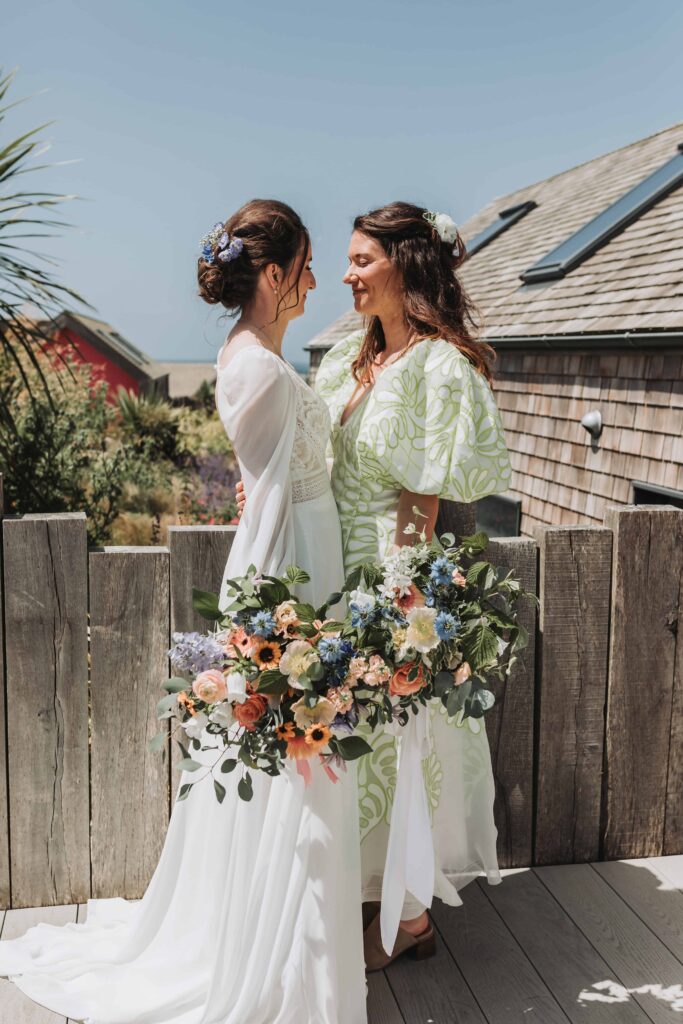 two brides looking at each other