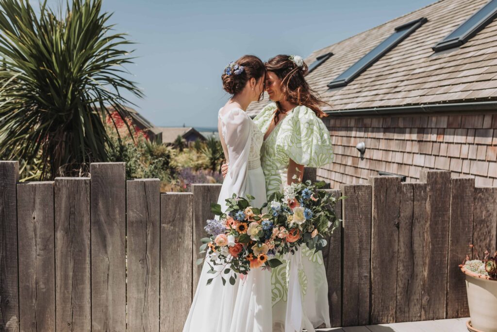 two brides sharing a moment together