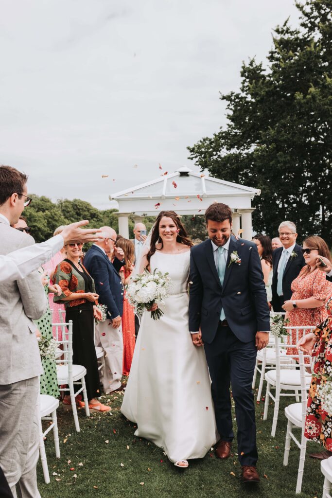 bride and groom walking up the aisle