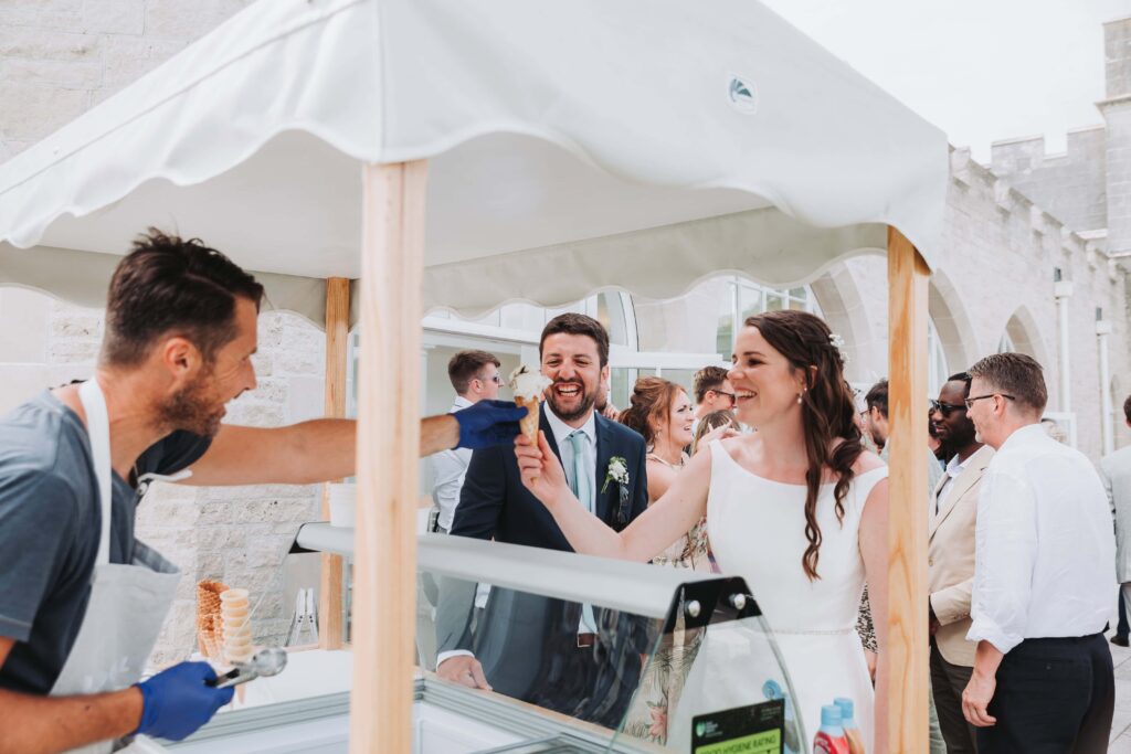 bride and groom having an ice cream