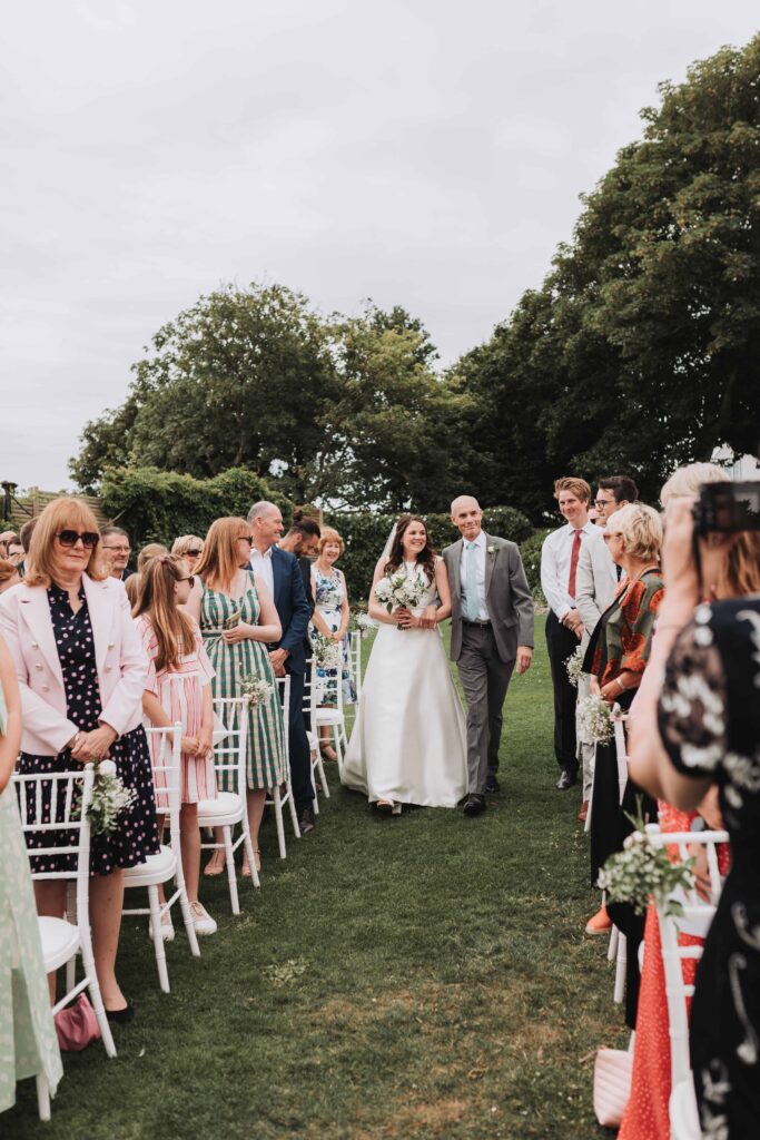 father of the bride walking bride down the aisle at pennsylvania castle estate