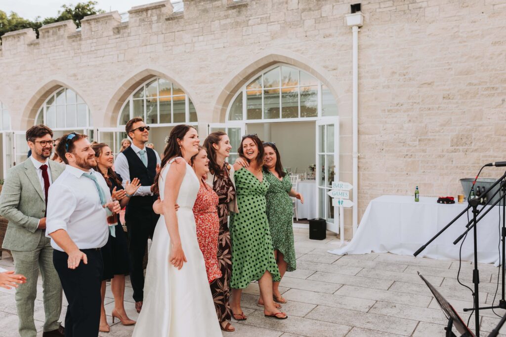 bride and guests singing with sea shanty band